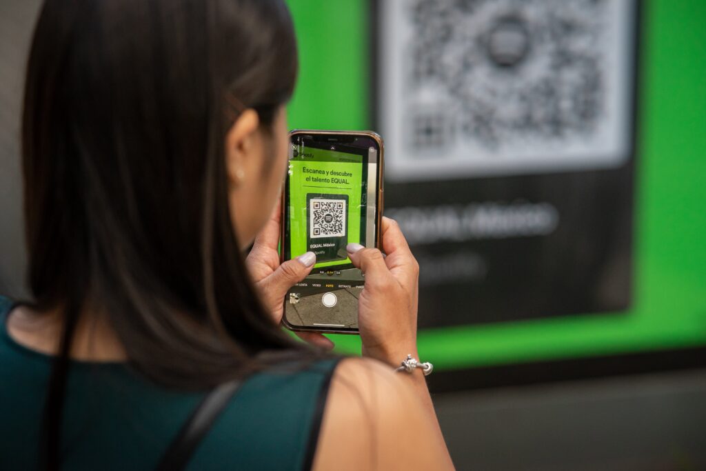 Picture of someone scanning a QR code with their mobile phone.